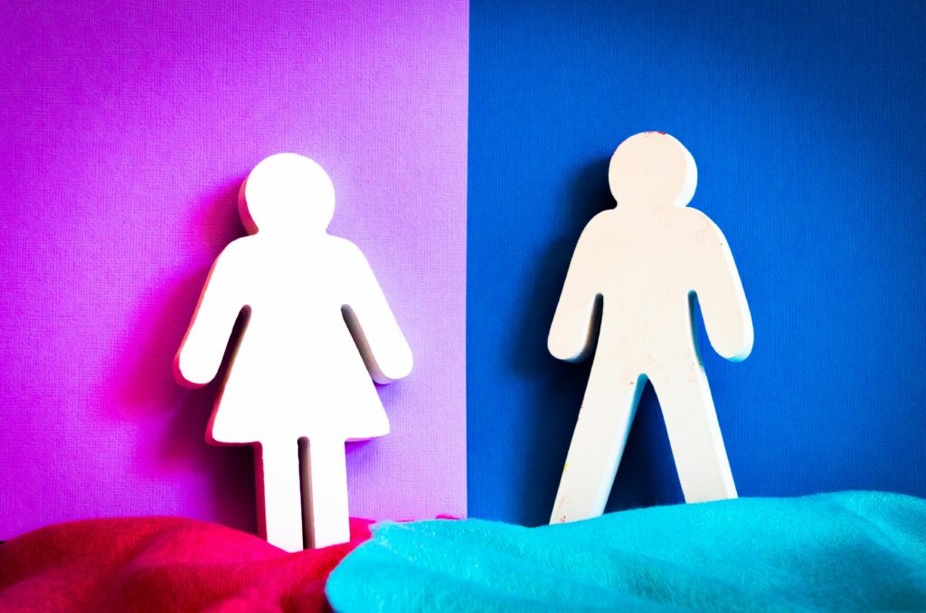 Cutout figures of a man and woman on vibrant purple and blue backgrounds.